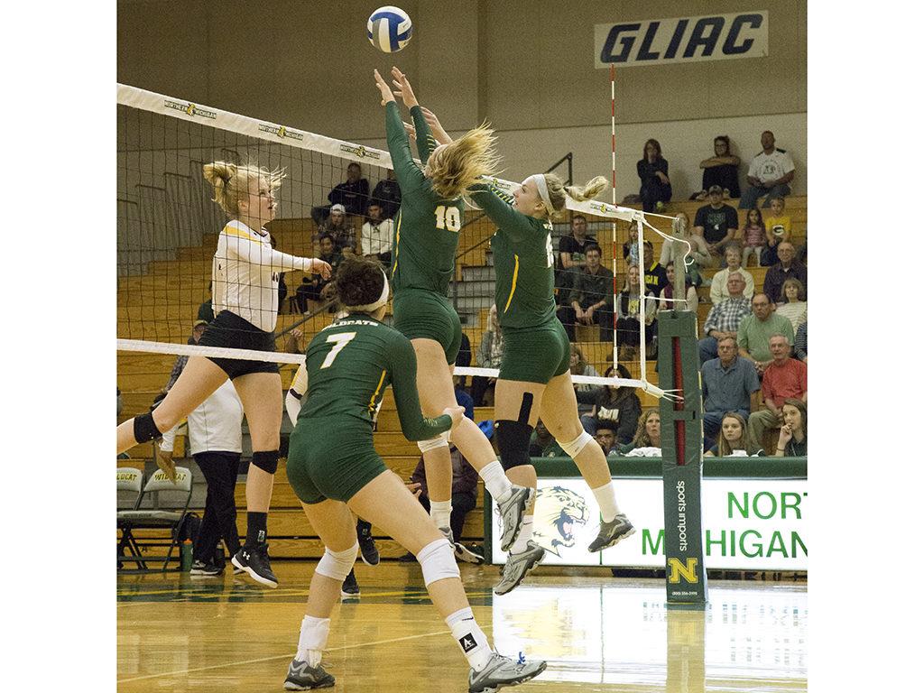 Photo+by+Neil+Flavin%3A+Senior+right-side+hitter+Madison+Whitehead+and+sophomore+middle+blocker+Sarah+Kuehn+attempt+to+block+a+return+from+an+Ashland+player.+The+team+averages+2.88+blocks+per+game+this+season.