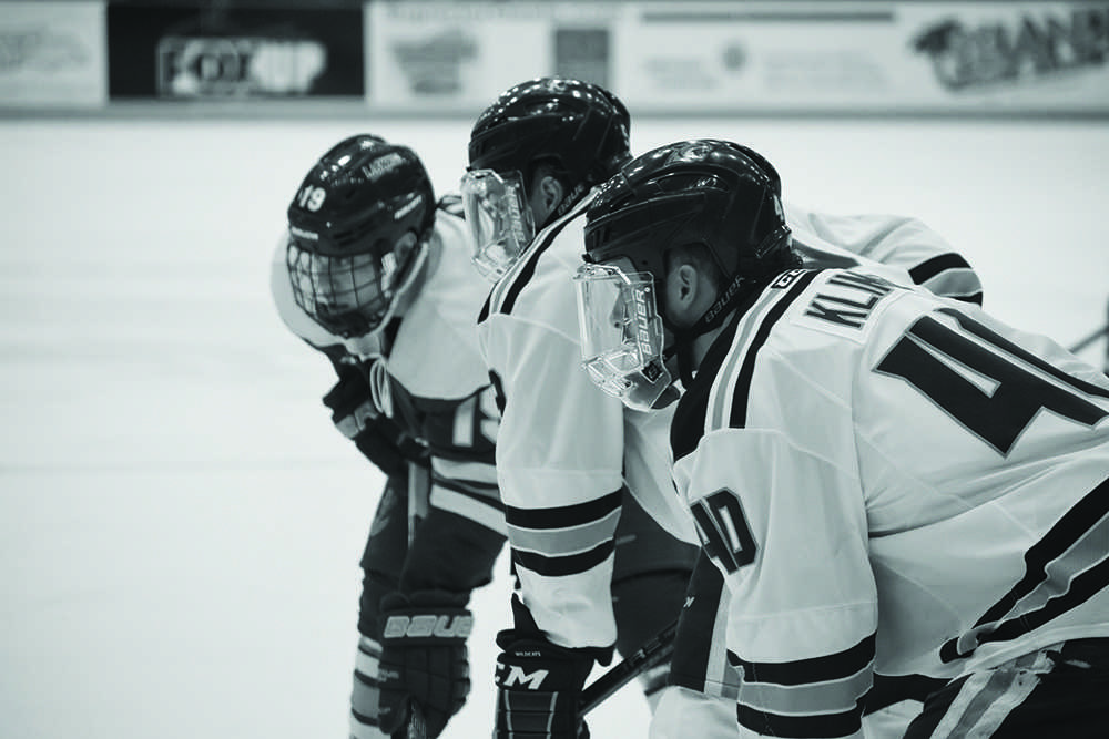 Senior+Defenseman+Jordan+Klimek+lines+up+at+the+faceoff+circle%2C+ready+to+start+a+play.+The+Wildcats+scored+six+goals+this+weekend+thanks+to+smart+offensive+zone+puck+movement.%0APhoto+by%3A+Lindsey+Eaton