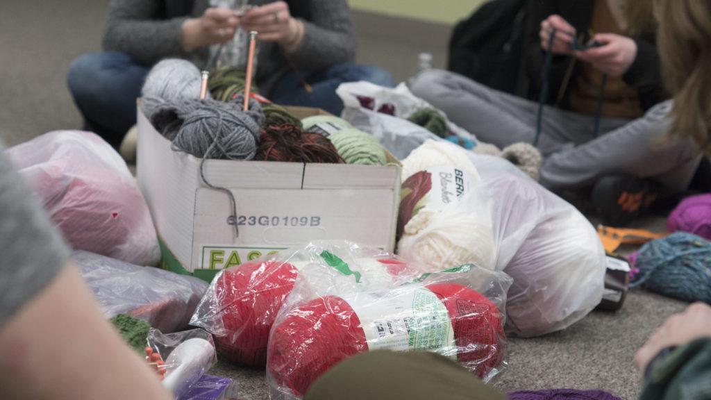 Students knit and crochet hats, scarves and mittens for community members who are less fortunate. The next event will be held Monday, April. 16 at 3:30 p.m. to 4:30 p.m. in the University Center’s Back Room (1213). Photo by: Kat Torreano