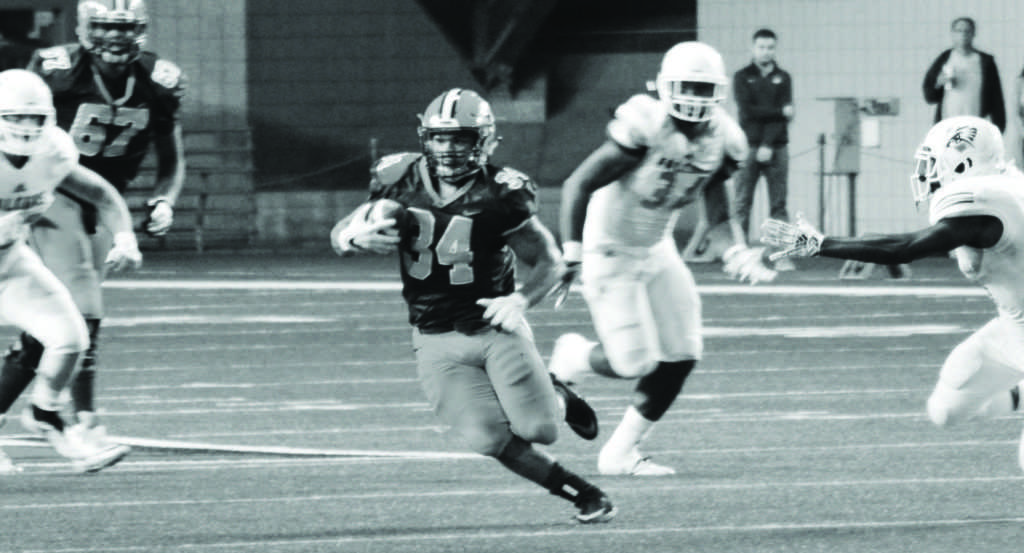 Senior running back Jake Mayon carried the ball 35 times for 224 yards in a win last weekend against the University of Texas Permian Basin. Mayon needs to rush for 574 more yards to pass the NMU all-time career rushing yard record set by Steve Avery between the 1985-88 seasons.
Photo courtesy of NMU athletics 