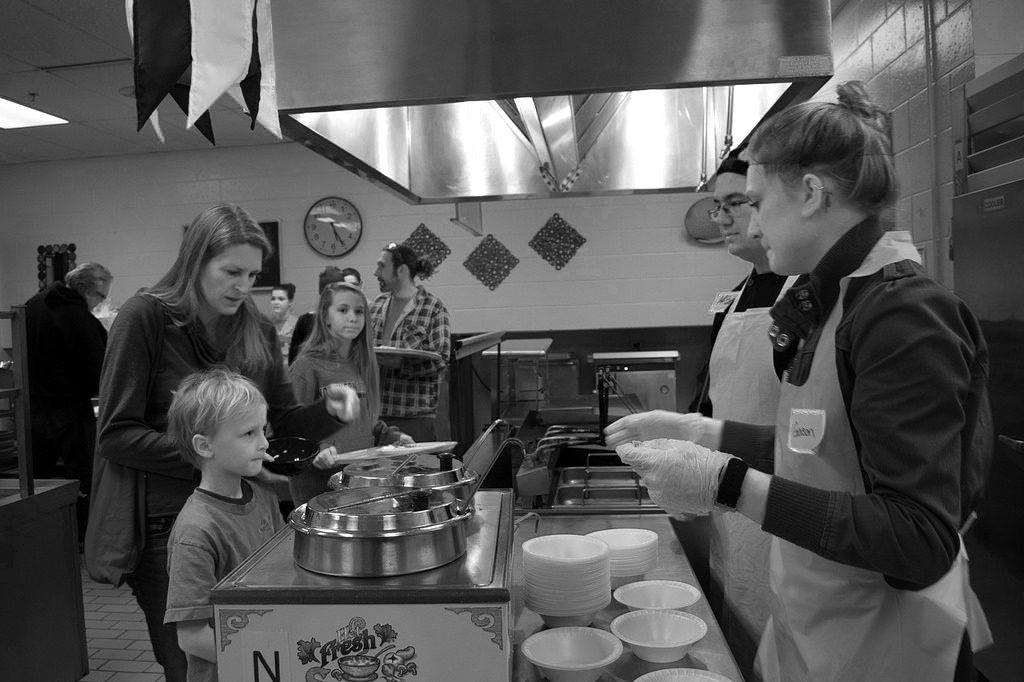 Students serve community members traditional and modern indigenous food at last years event.