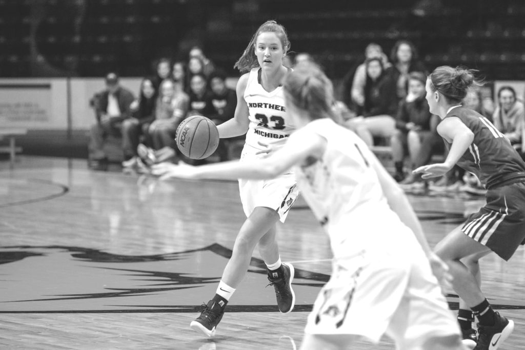 %0ANMU+senior+guard+Tess+Weatherly+looks+to+pass+the+ball+to+an+open+teammate+against+Finlandia+University.%0APhoto+courtesy+of+NMU+athletics