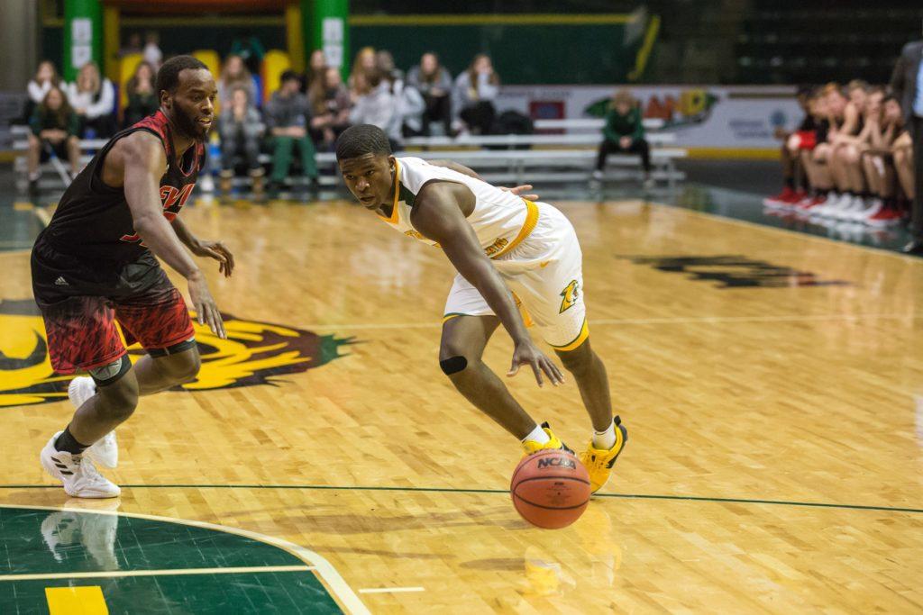 Senior guard Naba Echols made an impactful final impression on his last days on the Berry Events Center court. Echols recorded over 20 points in his final two games as the ’Cats won both matchups. 
Photo courtesy of NMU Athletics
