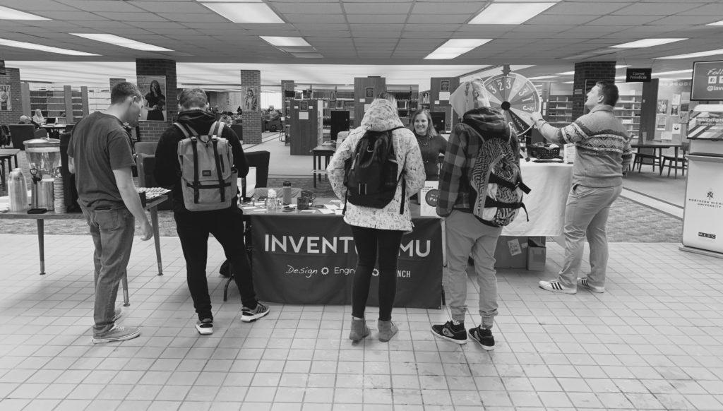 Students gather for refreshments and prizes during Invent@NMU’s event to celebrate the installation of their kiosk. Attendees were given the opportunity to enter a drawing for a free iPad and spin a wheel to win swag.  Sophie Hillmeyer/NW
