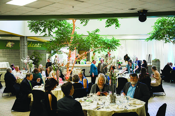 Guests of the 2017 Main Event, a Narnia-themed dinner, sit in a decked-out Jacobetti Complex that took participants through the wardrobe. The 2019 dinner, happening Friday, is circus themed. / Photo by NW Photo Archives