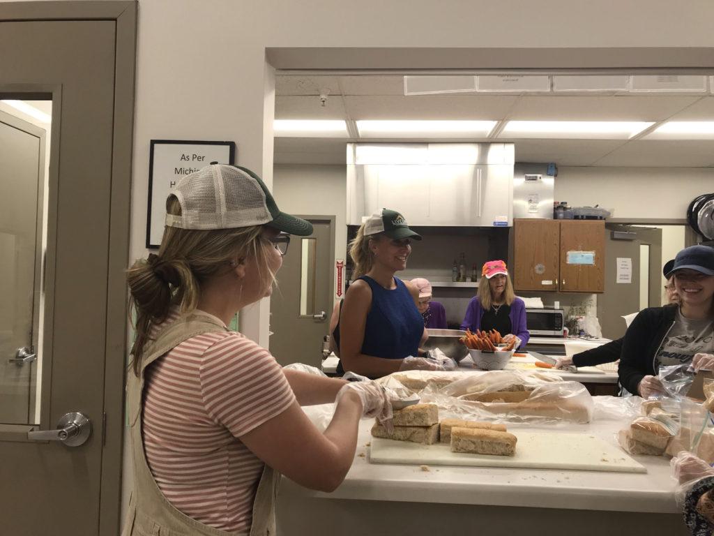 CATS AT WORK—Volunteers bag sandwiches for students at NMU’s chartered public school during their packing session on Wednesday September 25th at the Marquette Salvation Army.