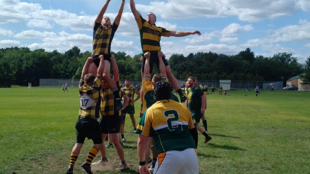 LINEOUT— “The Old Boys” go head-to-head against the Michigan Tech Huskies.
Photo courtesy of Steve Nemeckay