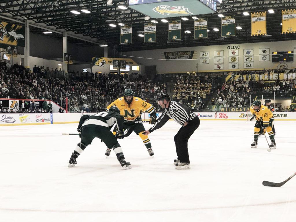 MOVING FORWARD—Luke Voltin prepares for the referee to drop the puck for the face-off on Saturday, Oct. 12, the second game of the home opener as  Garrett Lee looks on. The `Cats are now 1-1 on the season after splitting with the Spartans. NMU has a quick turn-around before that travel to Boston to take on the Boston University (BU) Terriers this weekend. Jackie Jahfetson/NW