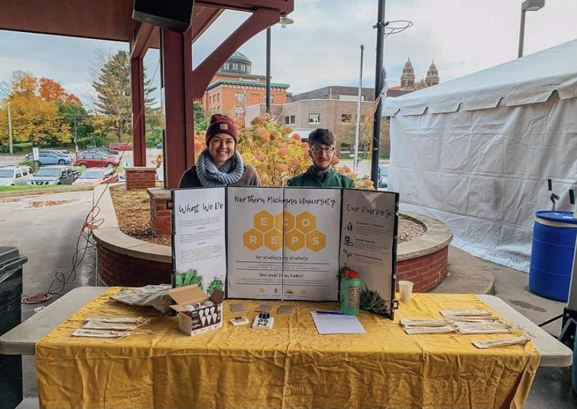 Photo courtesy of Rachel Lefor
ECO AWARENESS— Pictured Heather Vivian (left), Charlie Arnold. At the Farmers Market, downtown Marquette in September, 2019. EcoReps set up a table to promote the organization.