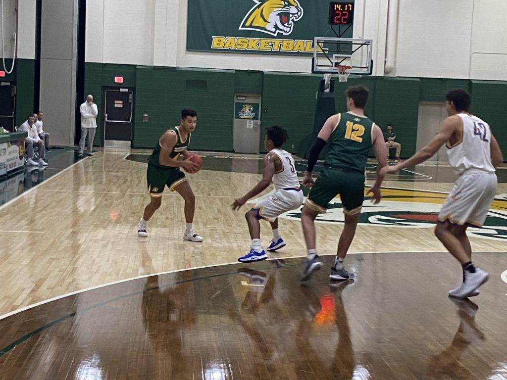 SEASON+OF+CHALLENGES%E2%80%94NMU+junior+guard+Max+Bjorklund+looks+to+score+against+the+Lake+Superior+State+defense+on+Sunday%2C+Jan.+31.+He+led+the+Wildcats+in+scoring+with+14.8+points+per+game+this+season%2C+and+the+campaign+came+to+an+abrupt+end+when+the+program+had+multiple+COVID-19+cases.+Travis+Nelson%2FNW