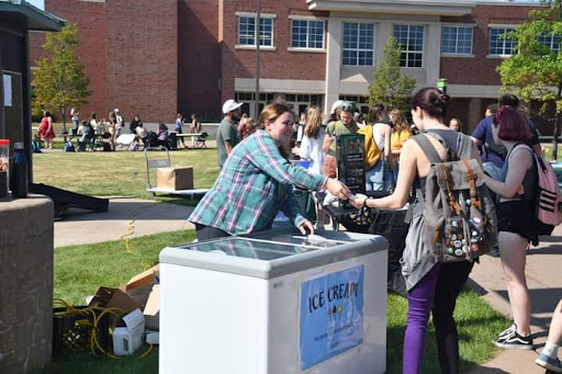 Photo courtesy of Cara Camps
SWEET TREAT—Avery Sommers, senior graphic design major, passes out ice cream during the 2021 Fall Fest which took place on Aug. 23 and 24.
