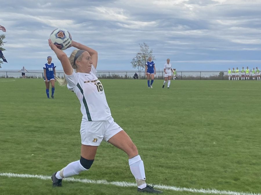 TOUGH OPENER—NMU senior defender Rachael Erste throws the ball in for the Wildcats in Fridays 4-0 loss to Grand Valley State. GVSU is the second-ranked team nationally in Division II, which is a tough way for the Cats to start conference action. Travis Nelson/NW