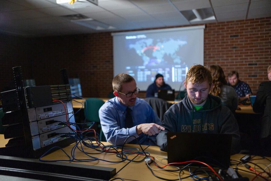 Photo courtesy of Matthew Vogt
IN THE LAB—Jim Marquardson, student adviser for information assurance & cyber defense, in the Upper Peninsula Cybersecurity Institute working with a student. The UPCI is the only facility of its kind in the U.P. and home to a community-based   resource for developing and diversifying a strong cybersecurity workforce in the U.P. for students. 