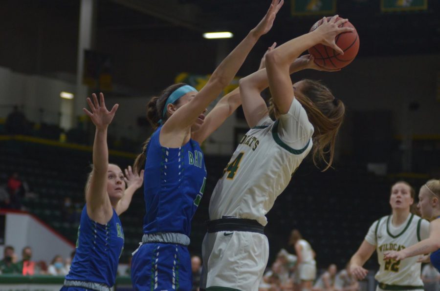 KNOCKING OFF THE RUST—NMU guard Makaylee Kuhn goes up for a contested shot during Thursdays dominating 101-29 over Bay College. The men also picked up a win over the Norse, and both teams begin the regular season in a couple of weeks. Travis Nelson/NW