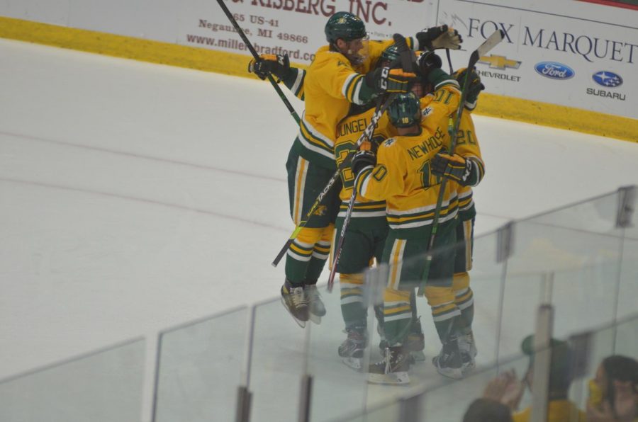 SWEET%2C+SWEET+SWEEP%E2%80%94The+team+celebrates+after+forward+Connor+Marritts+first+career+goal+put+NMU+in+front+2-1+in+the+first+period+of+Saturdays+win+over+St.+Thomas.+The+Cats+averaged+six+goals+per+game+on+the+weekend%2C+and+are+looking+good+to+start+the+season.+Travis+Nelson%2FNW