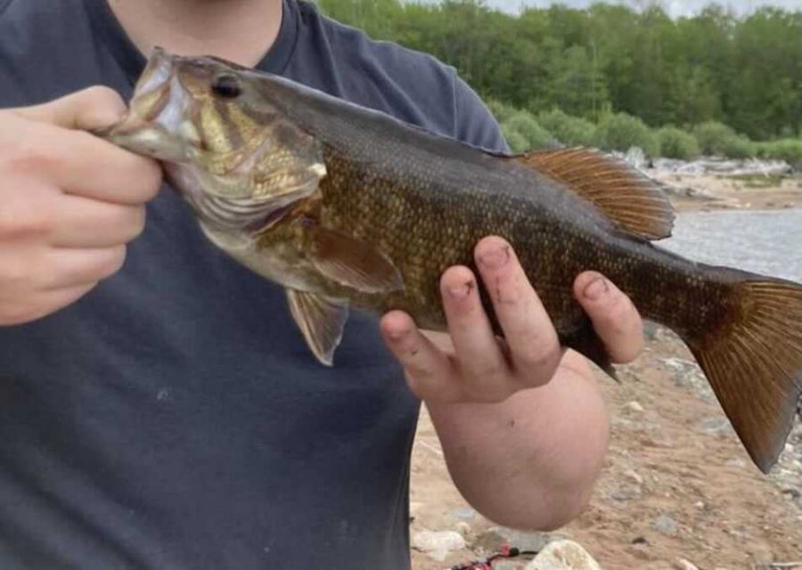 FALL FISHING SEASON—A local fisher catches a small mouth bass. With the fall season in fall swing, its a prime time to fish in the Marquette area. Dallas Wiertella/NW