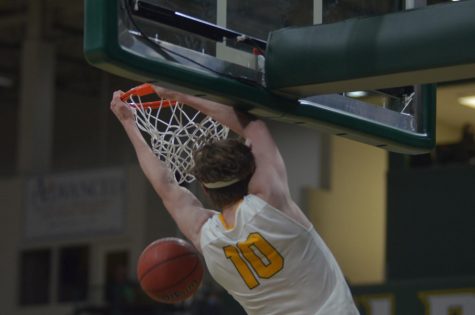 HEADING INTO GLIAC PLAY—NMU mens forward John Kerr hammers down a dunk during the Wildcats exhibition win over Bay College on Oct. 28, 2021. 