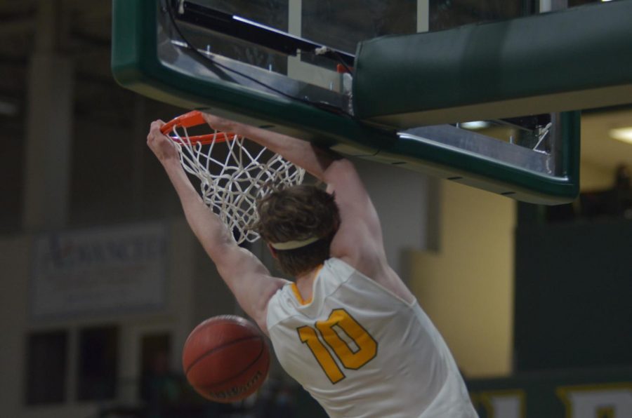 HEADING+INTO+GLIAC+PLAY%E2%80%94NMU+mens+forward+John+Kerr+hammers+down+a+dunk+during+the+Wildcats+exhibition+win+over+Bay+College+on+Oct.+28%2C+2021.+