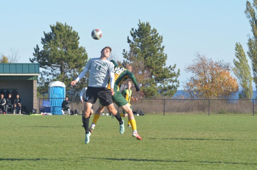 ONTO THE POSTSEASON—NMU midfielder Logan Lazar and UW-Parksides midfielder/forward Nikola Kesich go up for a contested ball during Thursdays match. The Cats fell 3-0 in the regular season finale, and will face Saginaw Valley State in the first round of the GLIAC Tournament on Monday.