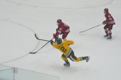 WEEKEND TO REMEMBER—NMU defenseman Trevor Cosgrove scores for the Wildcats in the second period against Colgate on Saturday, Jan. 8. This was one of Cosgroves three goals on the weekend against his former team of Colgate, where he played for four years. Travis Nelson/NW