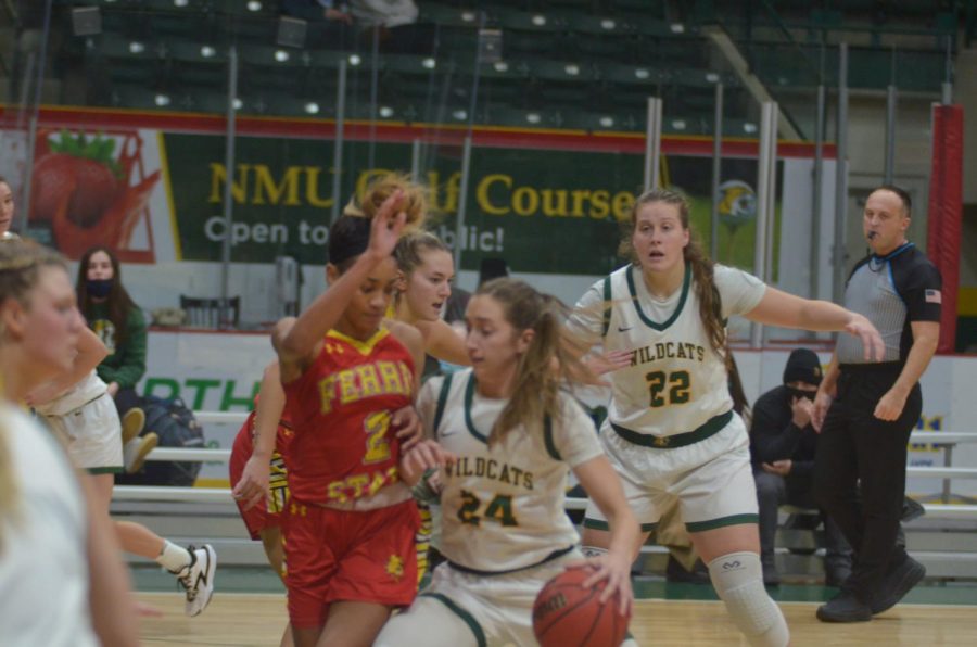 BRING ON THE TIMBERWOLVES—NMU guard Makaylee Kuhn drives to the rim during the womens' tight home loss to Ferris State on Thursday, Dec. 8. Both Wildcat squads look to get back on track in GLIAC play against Northwood on Saturday. Travis Nelson/NW