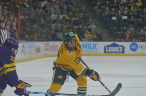 BACK DOWN TO EARTH—NMU defenseman Ben Newhouse shoots the puck in the second period during NMUs 4-1 loss to #1 Minnesota State-Mankato. The Wildcats won on Friday in the series opener, but the Mavericks came to play in the second game. Travis Nelson/NW