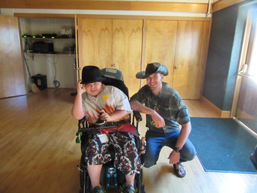 Zeke+Oswald+and+a+Bay+Cliff+camper+wear+cowboy+hats+to+a+Western+themed+dance+at+Bay+Cliff+Health+Camp.+The+camp+provides+opportunities+for+disabled+kids+in+the+U.P.+to+have+positive+and+therapeutic+summer+experiences.+