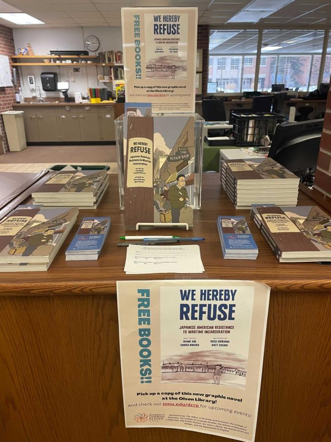 The Diversity Common Reader Program table in the library showcases this semesters book: We Hereby Refuse. The graphic novel focuses on Japanese internment camps and the struggles of Japanese Americans during WWII.