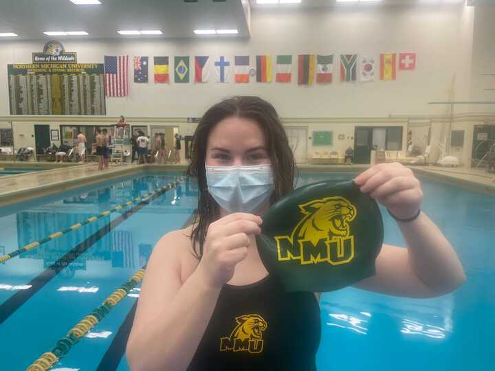 SWIMMING PAST THE PROTOCOLS—Izzy McCabe poses during the Wildcats swim and dive home meet. The swim and dive team, and all athletics at NMU, are dealing with the challenge of the COVID-19 protocols. Dallas Wiertella/NW