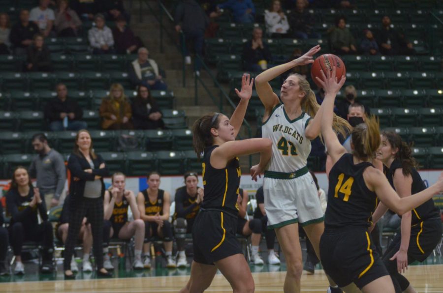 TIRED LEGS—NMU center Ana Rhude goes up for the jumper during the Wildcats 68-49 loss to Michigan Tech on Monday, Jan. 31. Travis Nelson/NW