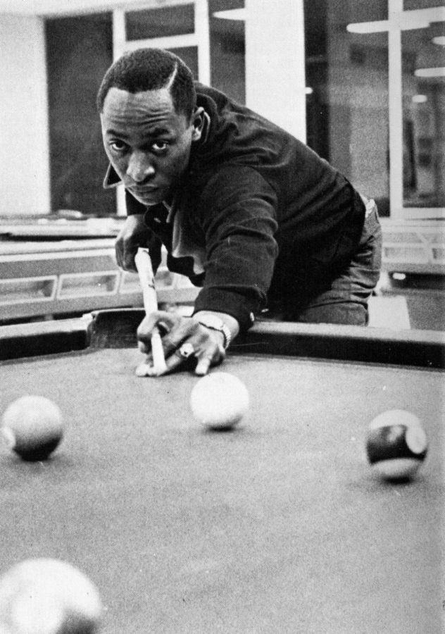 FIGHTING BACK - Charles Griffis, the student whose suspension led to the sit-in in Al Niemi’s office, lines up a shot at pool. Griffiss suspension led to a sit in protest by over 100 NMU students in 1969.