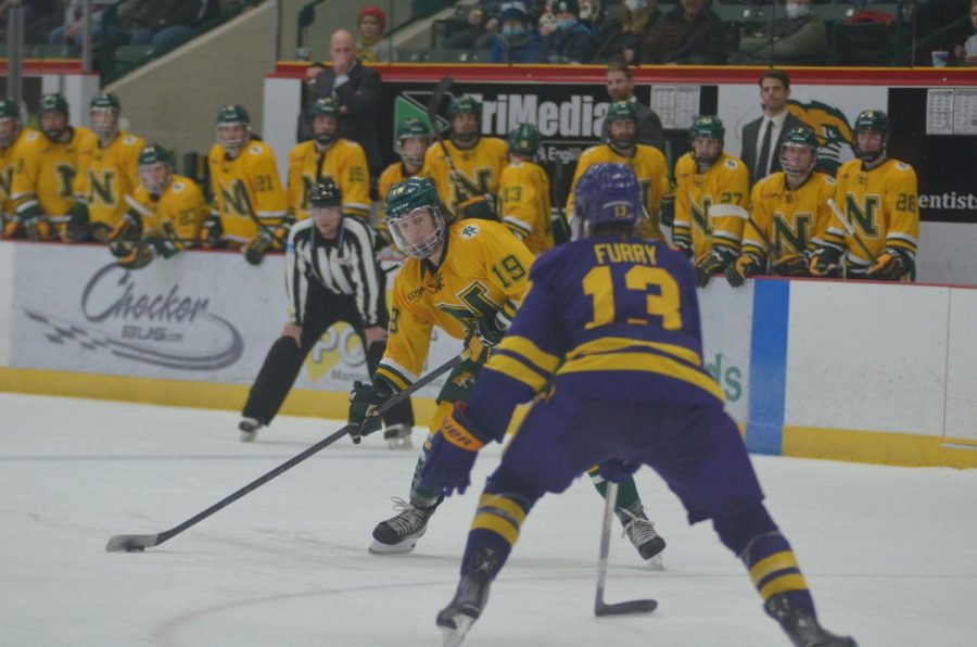 DAVID VS GOLIATH—NMU forward AJ Vanderbeck shoots a puck against Minnesota State-Mankato on Saturday, Jan. 15. The Wildcats will face the Mavericks again in the CCHA semifinals. Travis Nelson/NW