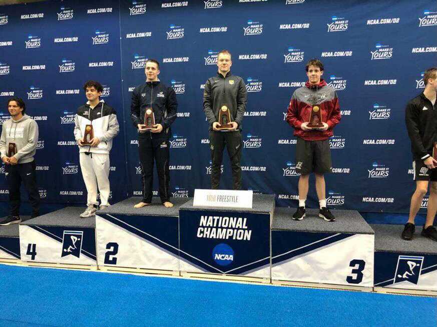 CHAMPION CATS—Ondrej Zach poses after winning the National Championship in the 1650-yard freestyle. The Wildcats had a solid go at it at Nationals with 13 All-American recipients. Photo courtesy of Ondrej Zach.