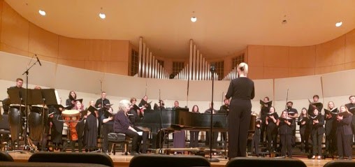 FINAL PERFORMANCE - Erin Colwitz directs her choirs on Thursday April 21. For many senior performers, this was their final choir performance.