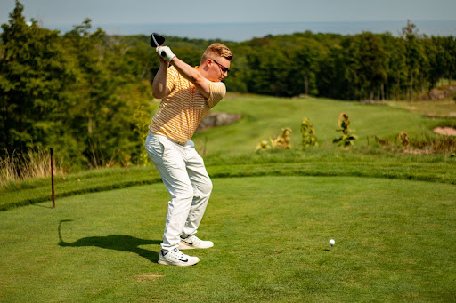 PRACTICE MAKES PERFECT - Chris Black practices his swings at the Marquette County Golf Club. Black has been playing golf since he was 12 when he learned with his father in Northern Ireland.