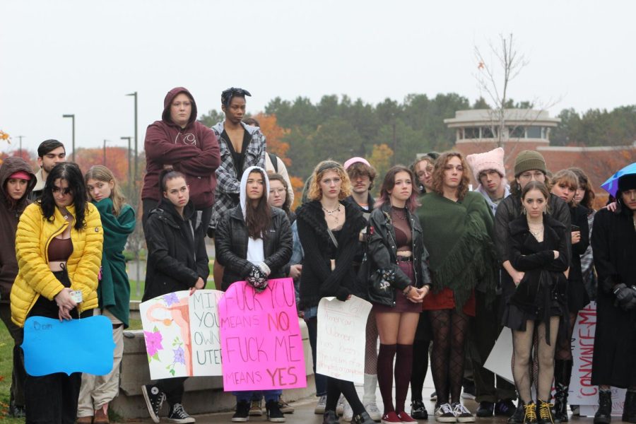 SOLIDARITY — Slut Walk attendees watch as speakers share their stories of sexual assault and harassment at the Wildcat Statue. Feminism For All hosted its sixth annual Slut Walk on Friday, an event uniting people in support of sexual assault awareness and prevention on campus.