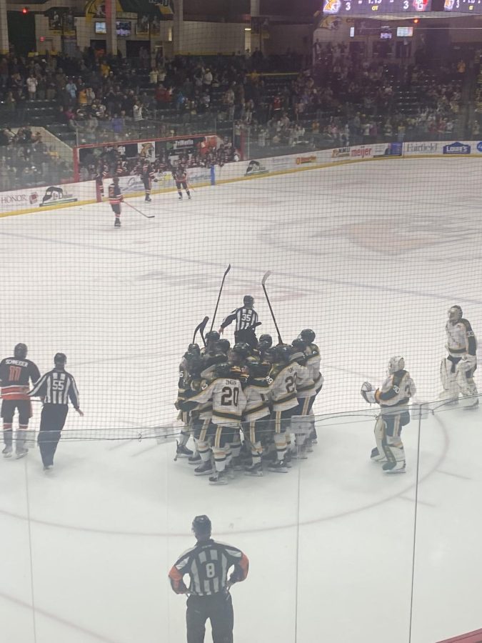 THRILLER- NMU celebrates the goal by A.J. Vanderbeck, winning the game in overtime.