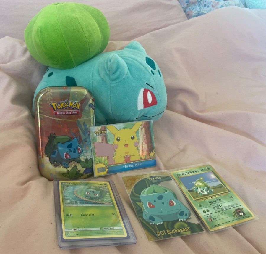 CATCH ‘EM ALL — My collection of Bulbasaur items, who is my favorite Pokémon, and the valuable Pokémon Topps “In the Pink” Series 3-Orange Islands card. Pokémon extends well beyond the card game, with films, video games and other collectibles for fans like me to enjoy.