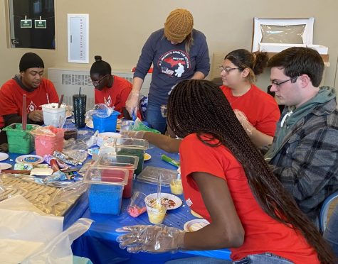 DAY OF SERVICE - Members of Black Student Union frost and decorate cookies to be brought to the Jacobetti Home for Veterans. Other donations collected during MLK Jr. Day Service Projects are to be made to the Womens Shelter and UPAWS.