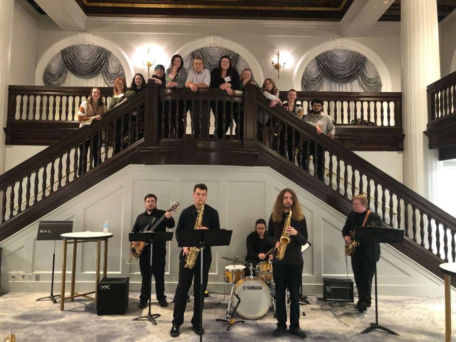 MUSIC CONFERENCE - NMU Jazz Combo (pictured below the staircase) performing after attending the collegiate reception at the 18th Annual Michigan Music Conference in Grand Rapids. NMU NAfME (pictured at the top of the stairs) also attended the collegiate reception.