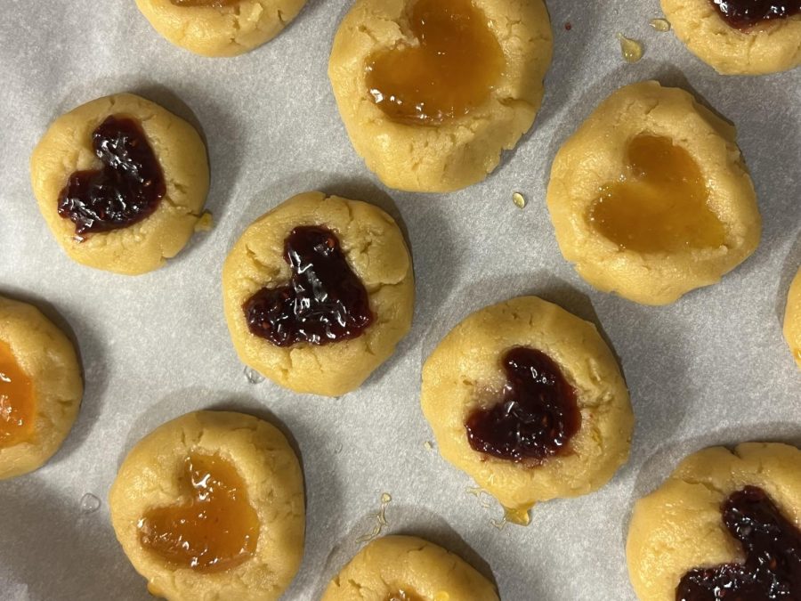 THUMBPRINT HEART COOKIES — love is still in the air with sweet crumbly treats that many college students can make in their own homes. Add your choice of filling or jam for a dash of sweetness.