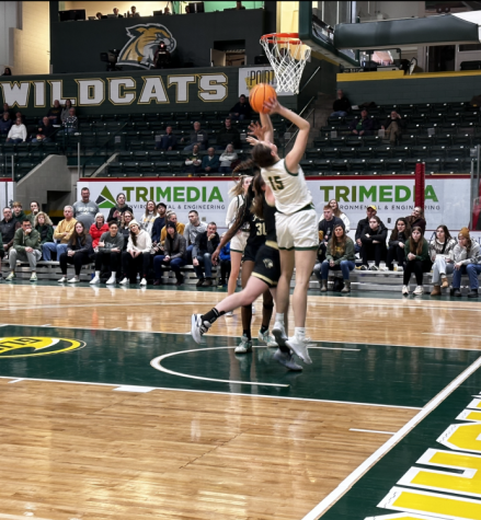 LAY UP - NMU Forward Elena Alaix goes up for the and-1 against Purdue-NW last Saturday. NMU won the game 84-78.