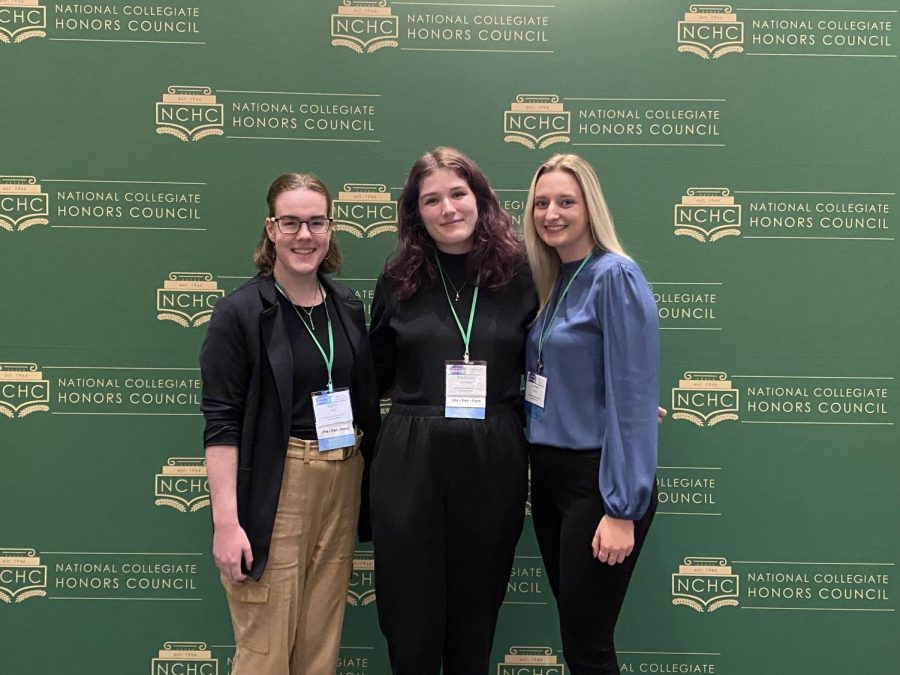 STUDENTS PRESENT RESEARCH — Students Mary Kelly (left) and Madison Christie (center) are two honors program students that presented research at the National Collegiate Honors Council conference in Dallas. The NCHC conference is held yearly and hundreds of honors students from across the country attend to present their research to experience different academic events and activities, seminars and group conversations to enhance university-level honors programs around the United States.