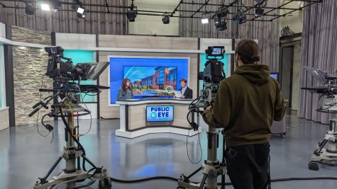 Two news anchors prepare for their practice show, which occurs an hour before Public Eye News (PEN) airs on live television. Studio A at WNMU-TV received a makeover for the first time since it was established in the 1970s. 