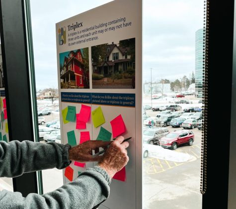 COMMUNITY DEVELOPMENT - Marquette community members give their opinions on affordable housing and other issues included in the community master plan during open house in the NMU Northern Center. 