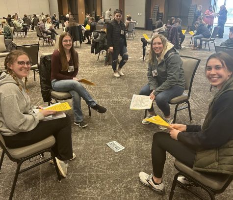 DEVELOPING EMPATHY - NMU students gather in a group for their assigned “family.” Each participant in the simulation is assigned a family to work with as they view what it’s like to experience poverty. The simulation lasts three hours, each hour acting as a month of living in poverty.