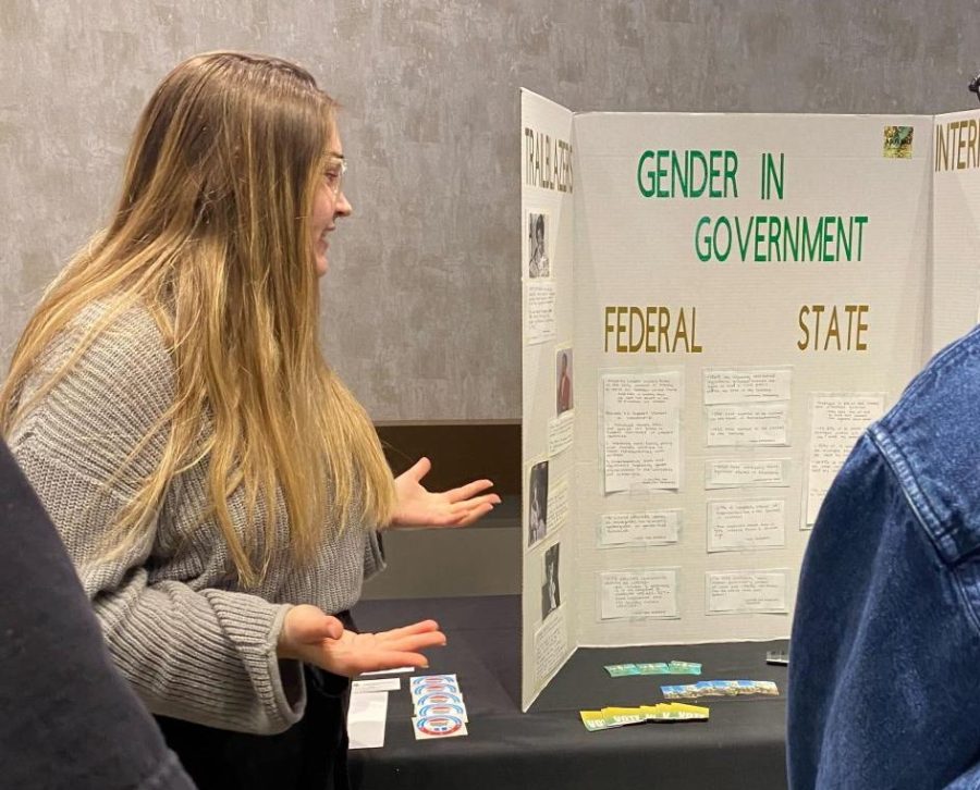 GENDER+IN+GOVERNMENT+-+ASNMU+Vice+President%2C+Gwendolyn+Feamster%2C+presents+the+history+of+gender+in+government+during+the+annual+Gender+Fair.+The+fair+was+hosted+by+the+Gender+and+Sexuality+Studies+program%2C+and+offered+a+selection+of+different+organizations+that+gave+poster+presentations+at+their+booths.