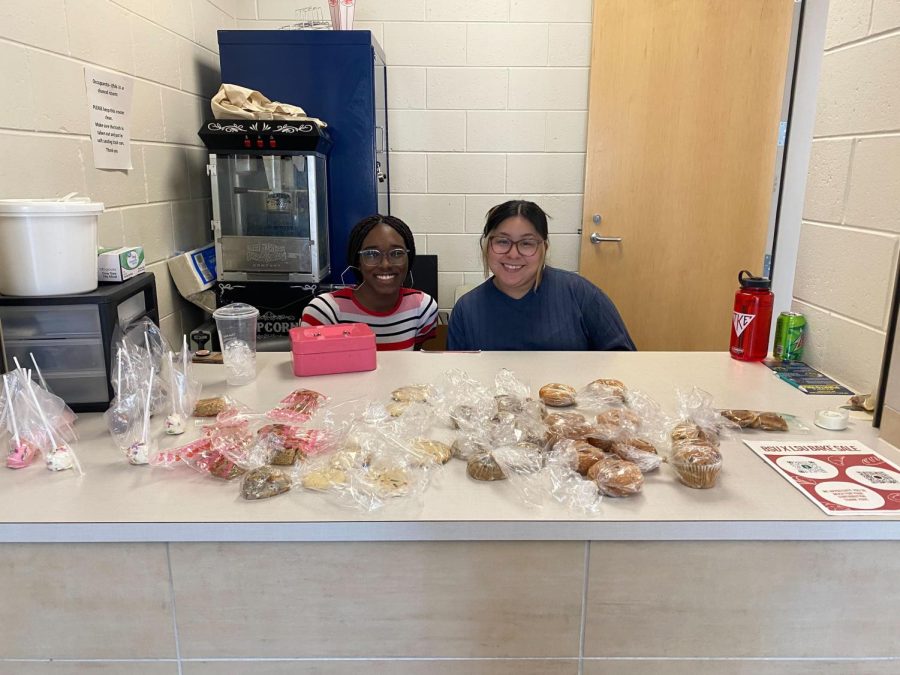 STUDENT ORGANIZATION FUNDRAISING - BSU President Marlanaysia Rosser (left) and LSU President Rosalva Brito (right) sell baked goods during their bake sale fundraiser in Jamrich Hall, Thursday, April 13. The fundraiser was held in order to gain funding for both clubs for merchandise and future events.