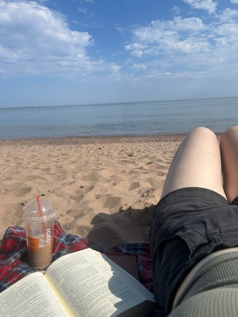 GETTING OUTSIDE — Taking a break from studying at Pebble Beach to breathe and enjoy one of the sunnier days in Marquette (with a coffee of course).