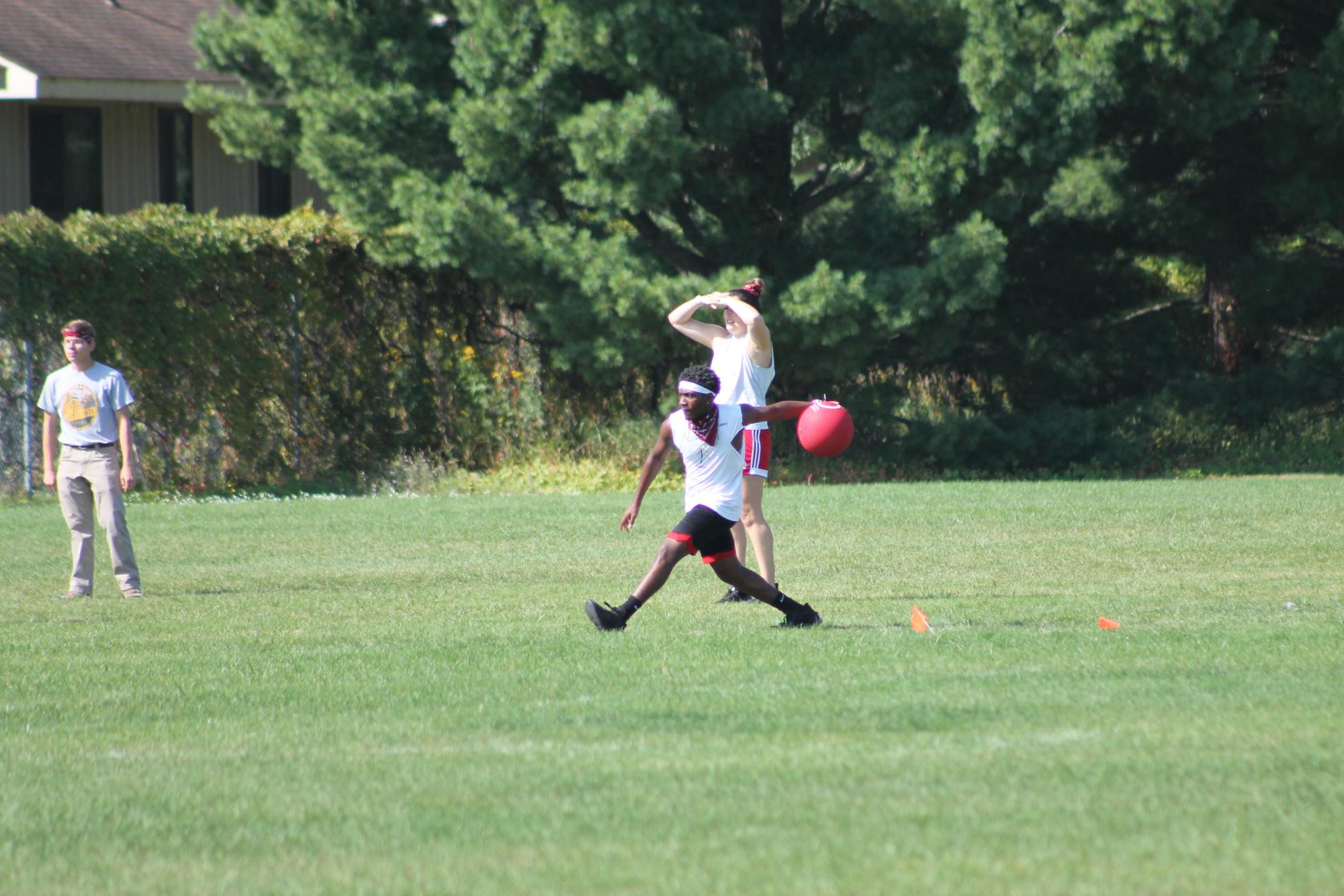 MAKING MOVES — In an intense game, a student prepares to roll the ball with eyes on the prize.